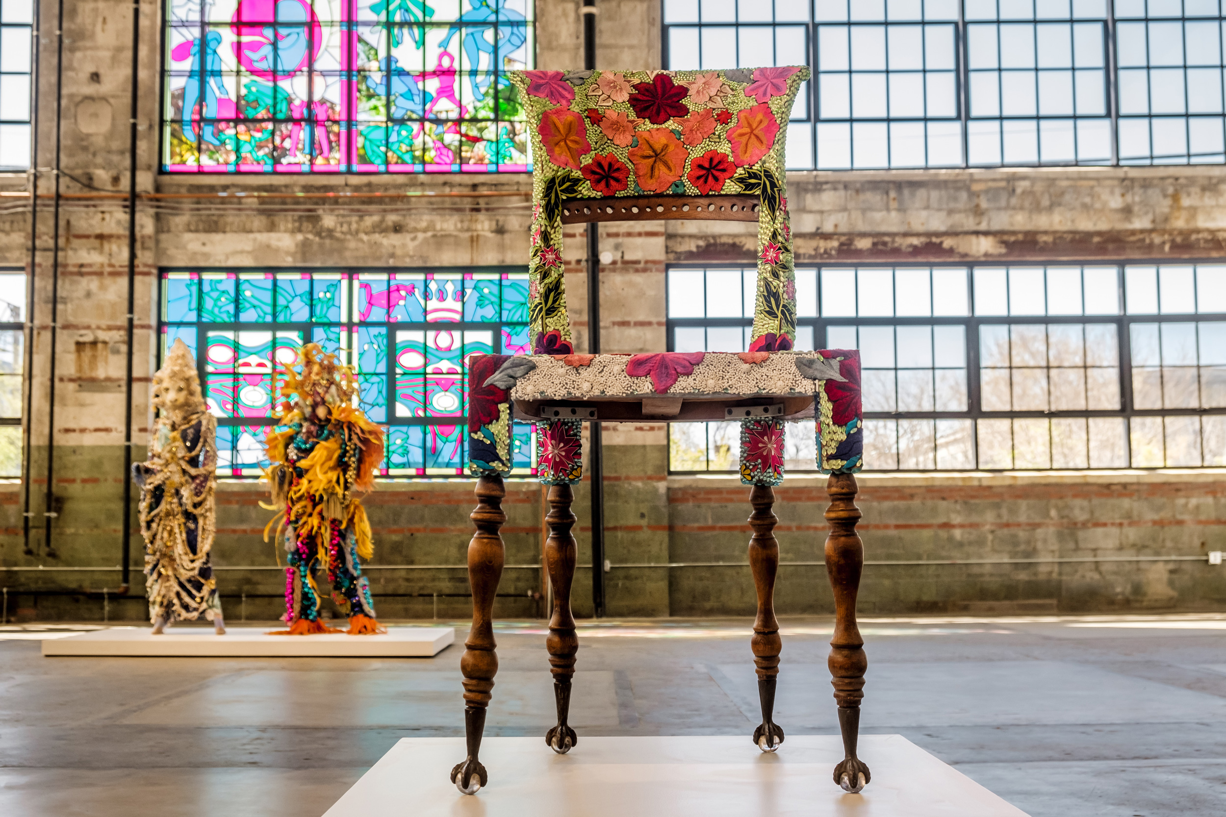 beaded chair in a room with stained glass windows